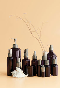 a group of brown bottles sitting next to each other